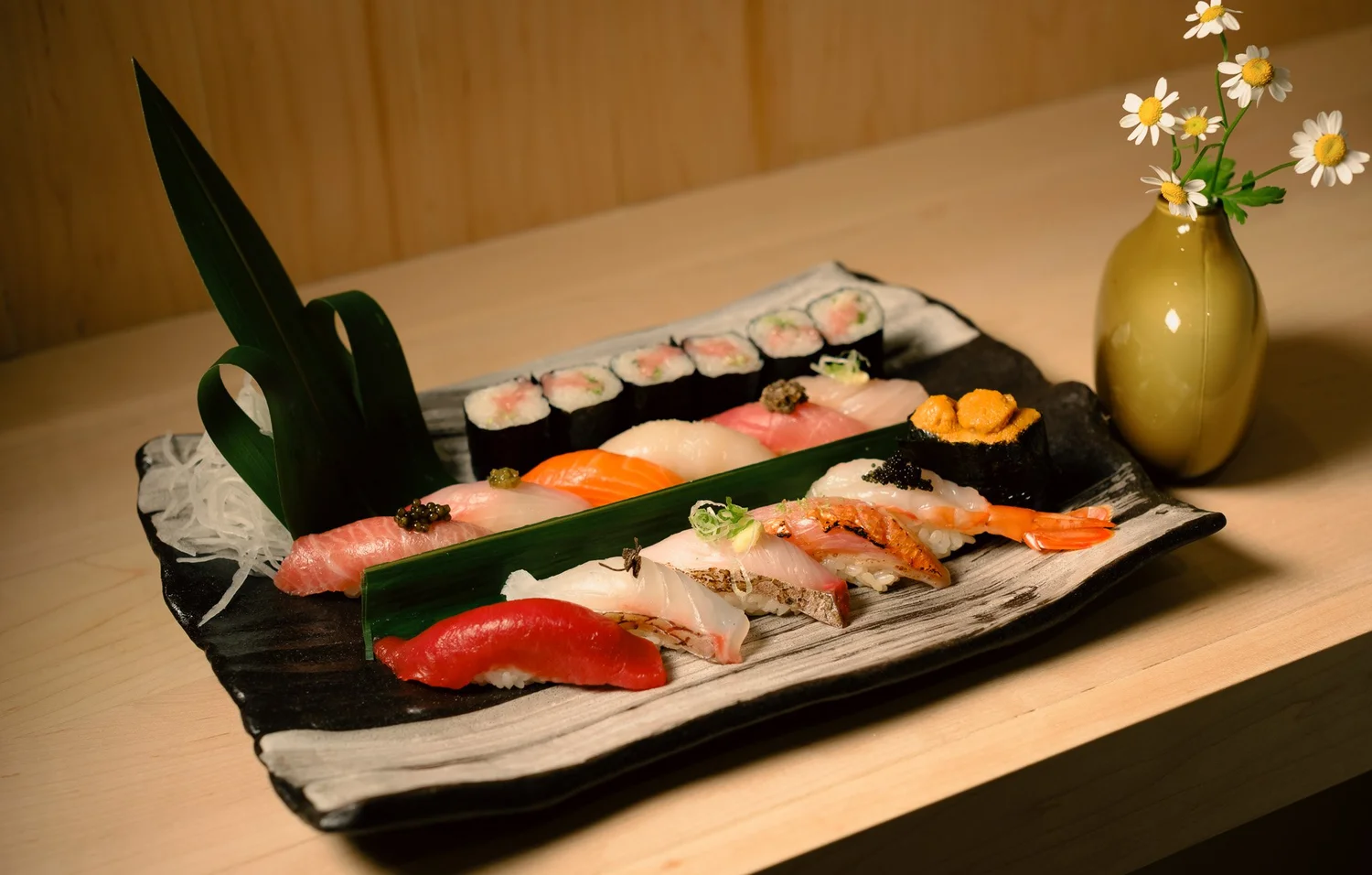 Chef preparing nigiri at the Atto Sushi counter